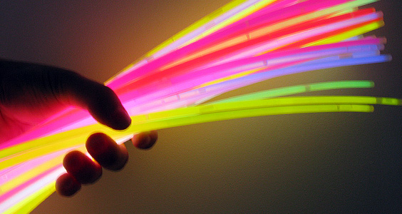 Holding a bunch of glow stick necklaces
